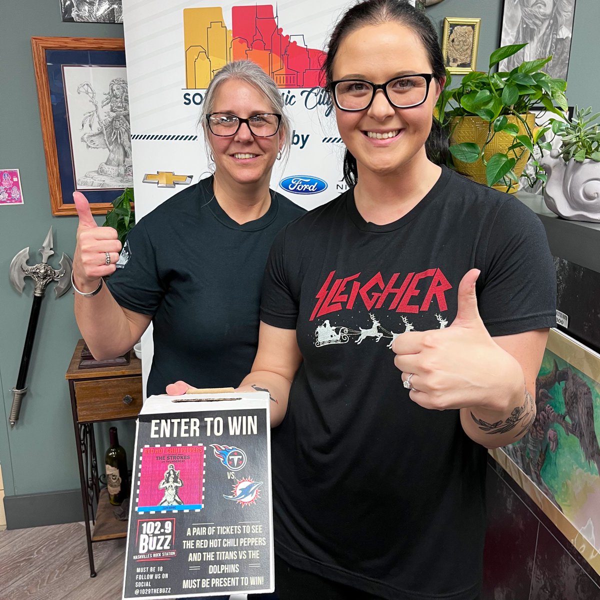1029thebuzz's tweet photo. Sharen in Mt. Juliet was our #12DaysOfTickets winner of @ChiliPeppers and @Titans tickets! Congrats, and thanks to everybody that came by Titan Tattoo today! https://t.co/7elf0BA2zc
