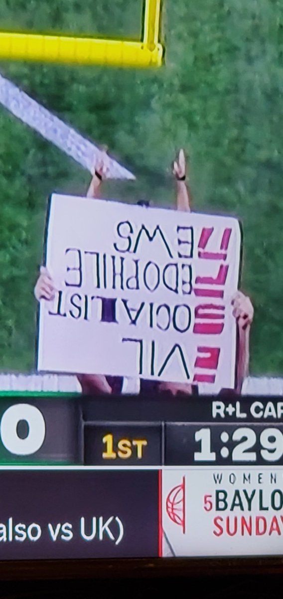 Funny sign guy holding it upside down on ESPN during the New Orleans Bowl with Marshall and Louisiana.