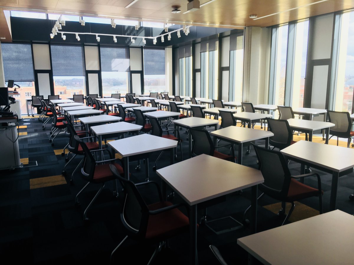 Photograph of the 4th floor room at Main Library with desks laid out in an examination format, ie. spaced seperately.