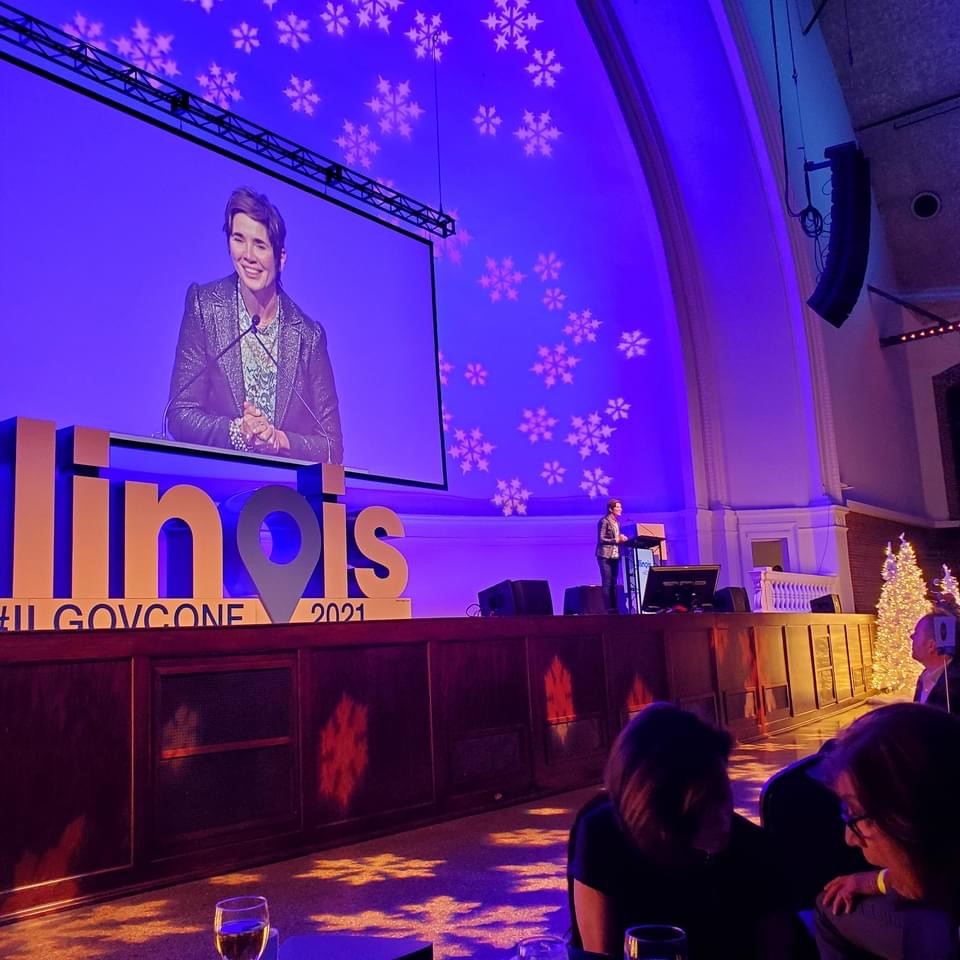 Dave Herrell, President and CEO of Visit Quad Cities and Chairman of the Illinois Council of Convention &amp; Visitors Bureaus, spoke at the <a href="/ilgovconf/">ILGovConf on Tourism</a> on tourism. He presented <a href="/GovPritzker/">Governor JB Pritzker</a> with an Illinois Made token of appreciation from the industry for his support of tourism