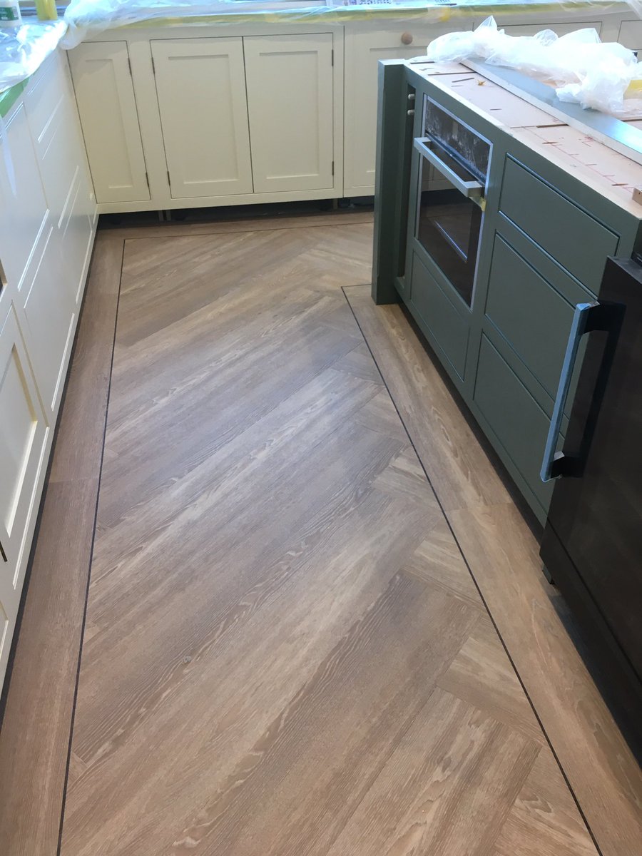 A beautiful large herringbone effect with border in Opus Niveus @KarndeanFloors