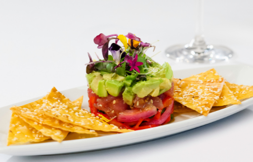 Our chefs have been preparing some new dishes just for you. Try our Tuna Stack appetizer: sliced ahi tuna served with soy ginger sesame sauce, avocado, and fresh English cucumber salad.