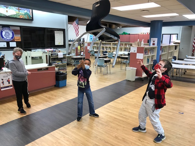 This is what happens when Mr. Babb walks out of the library, and Mr. Cerny wants to teach his reading group background knowledge about pulleys! 😀 #YourCommunitySchools @BabbWashLLC