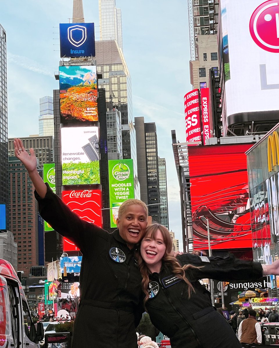 Two astronauts taking a bite of the big 🍎 @DrSianProctor