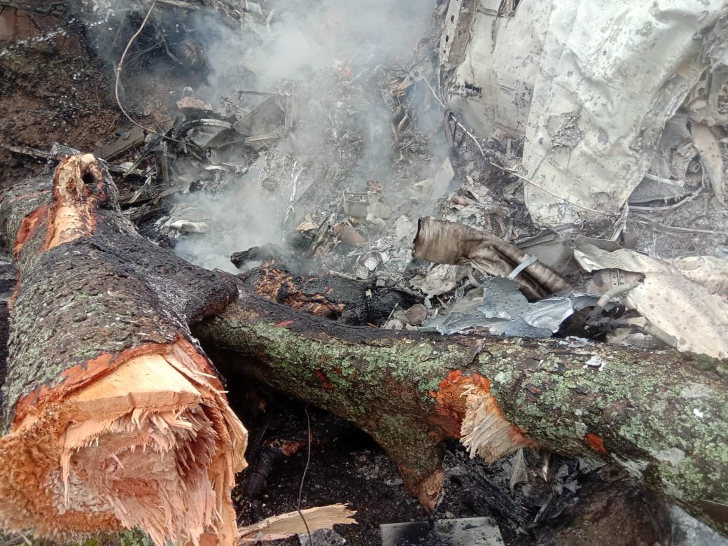 ANI's tweet photo. Latest visuals from the spot (between Coimbatore and Sulur) where a military chopper crashed in Tamil Nadu. CDS Bipin Rawat, his staff and some family members were in the chopper.

(Pics Source: Locals involved in search and rescue operation) https://t.co/miALr88sm1