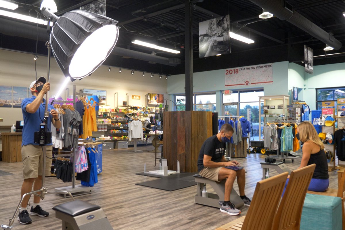 Wesley setting up a light to film broll with Fleet Feet Madison. @fleetfeetmadison