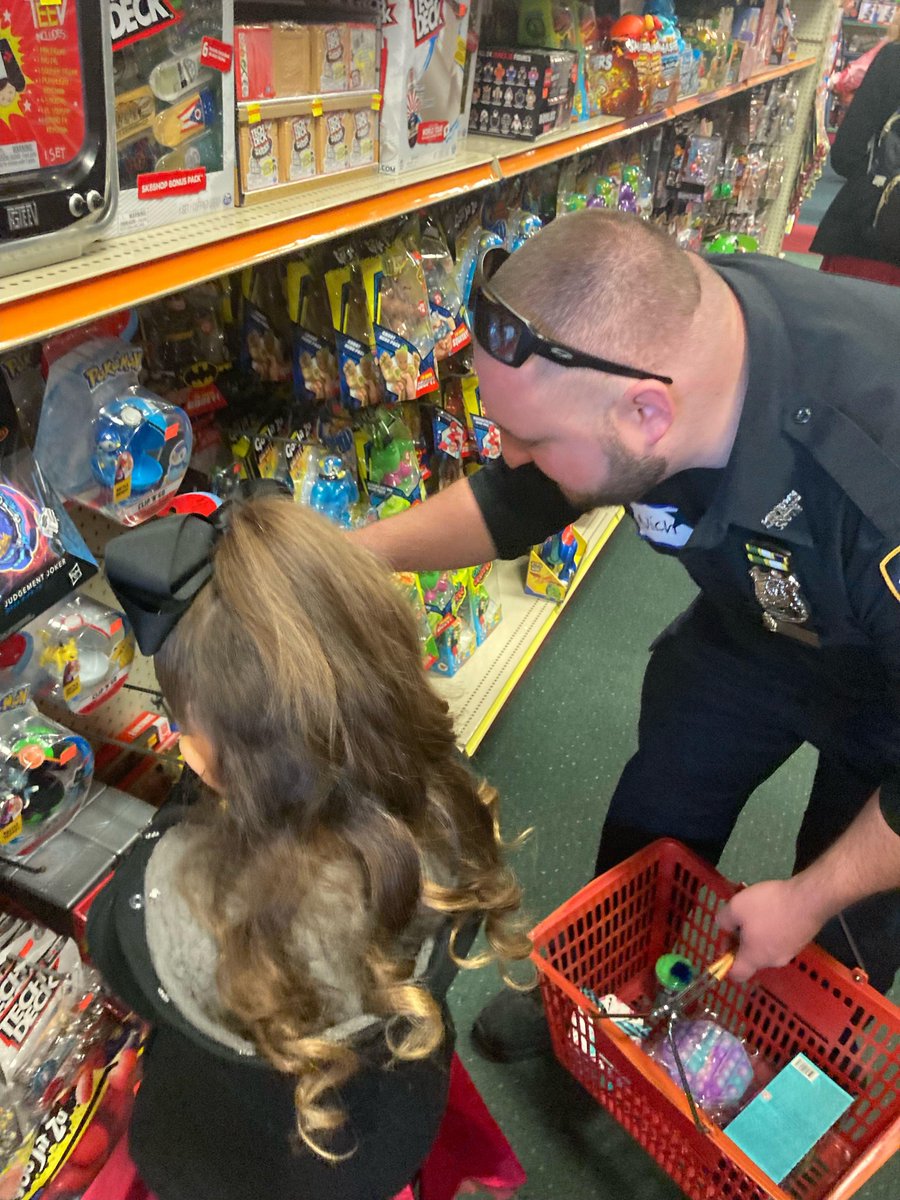 NYPDMTS's tweet photo. Over the weekend, our Neighborhood and Youth Coordination Officers, Mitchell and Enright, participated in The #ProjectThankACop 2nd Annual Holiday Shop with a Cop Day. 🎄🧸🎁 https://t.co/8euIYNuBkA