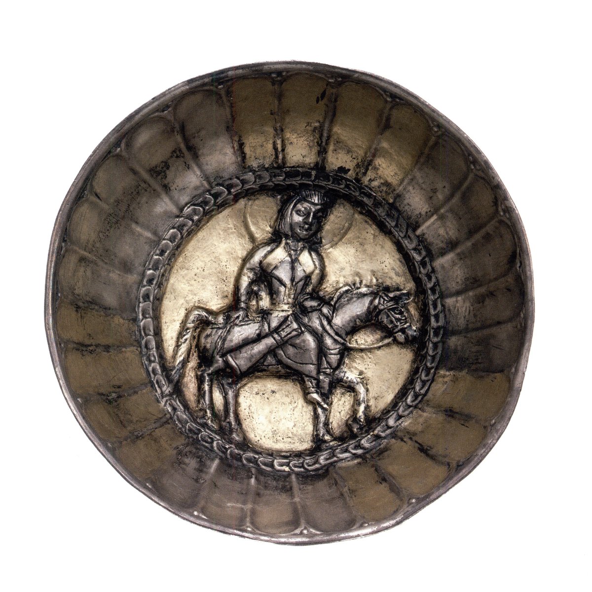 Gilded silver dish from Khwarazm showing a horseman with a lapel coat and a bowcase, with a halo around his head. 7th - early 8th C
Image from the Cultural Legacy of Uzbekistan catalogue

patreon.com/eranudturan