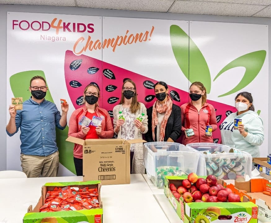 CAANiagara's tweet photo. This morning, the #CAANiagara marketing team visited @food4kidsniag to assemble 300 food packages to help children across #Niagara stay nourished this weekend. To learn more about the important work #Food4KidsNiagara does for our community, visit https://t.co/pXA9r1klSa. https://t.co/kcBLX7NZq4