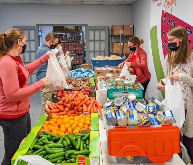 CAANiagara's tweet photo. This morning, the #CAANiagara marketing team visited @food4kidsniag to assemble 300 food packages to help children across #Niagara stay nourished this weekend. To learn more about the important work #Food4KidsNiagara does for our community, visit https://t.co/pXA9r1klSa. https://t.co/kcBLX7NZq4