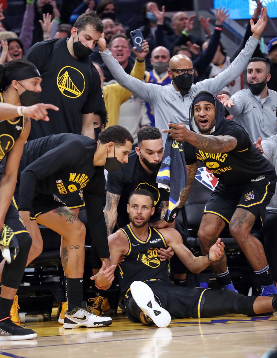 ScottStrazzante's tweet photo. Golden State @Warriors' Stephen Curry and the Warriors' bench react after Curry was knocked to the court while hitting a 3-pointer against Trail Blazers. No foul was called on the play. Curry has 4 treys at halftime. @sfchronicle photo by @ScottStrazzante https://t.co/DTJKx2WvsQ