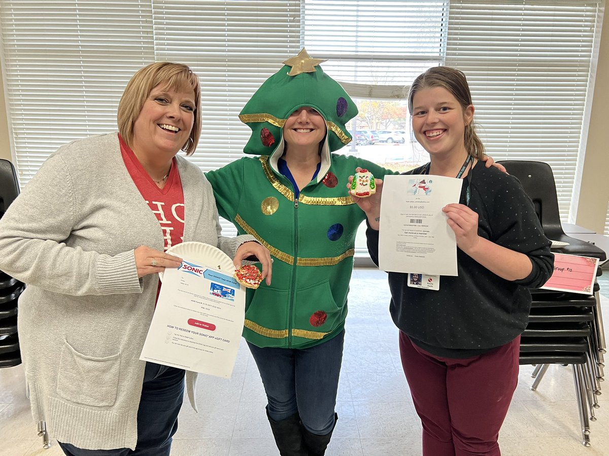 wellstigers's tweet photo. Cookie decorating at Wells staff meeting was super fun! One winner for prettiest sweater (to Kayla Janik) and ugliest sweater cookie ( to Ashley Brumbelow) #planoisd @SaraMeyer7ut @Lavadonley https://t.co/MgpfY7itZu