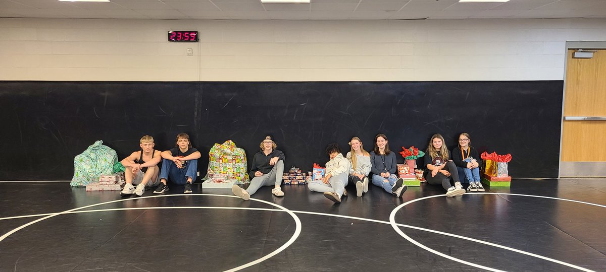 Very happy with our @wrestlejags tonight. Our wrestling family adopted a local family with five children. Our Wrestlers and families bought gifts and wrapped presents for this family. Thanks to @whccevans for coordinating this! #winterwishes @WestmooreHS