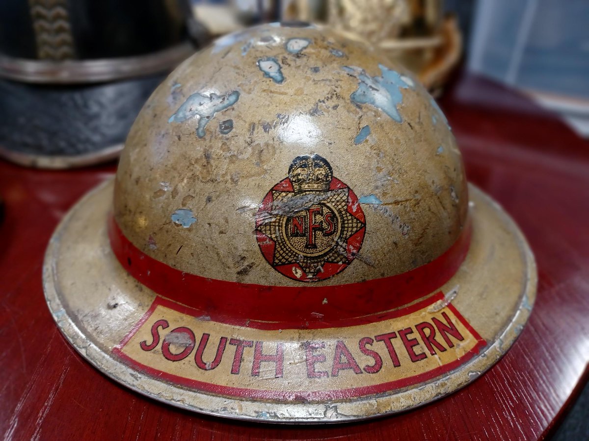 MuseumScotFire's tweet photo. This 'tin' helmet -actually made of steel- was introduced just before WWII. It was worn by Column Officer Robertson of the A2 Sub Area in the South East Scotland Fire Force of the National Fire Service. The colour &amp; red band  identify that he was a 'senior officer' and his rank. https://t.co/Ql9z6cqyt2
