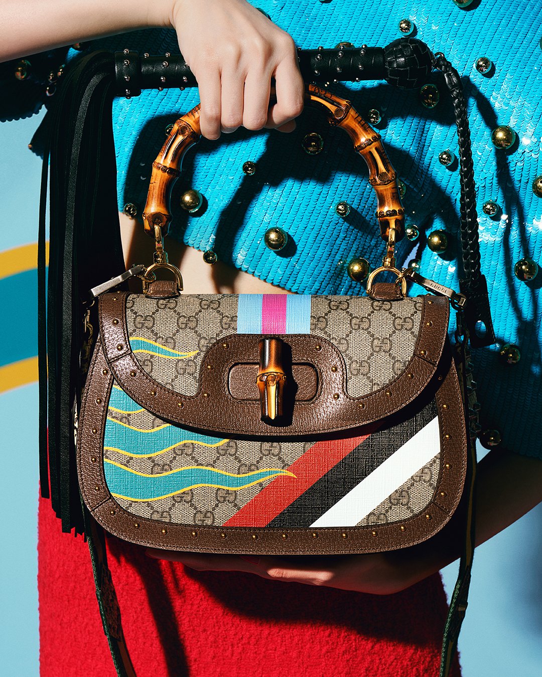 gucci on X Inspired by an archival design from the 40s a bamboo top handle bag is reimagined by AlessandroMichele with colorful geometric patterns in a nod to the House s equestrian heritage