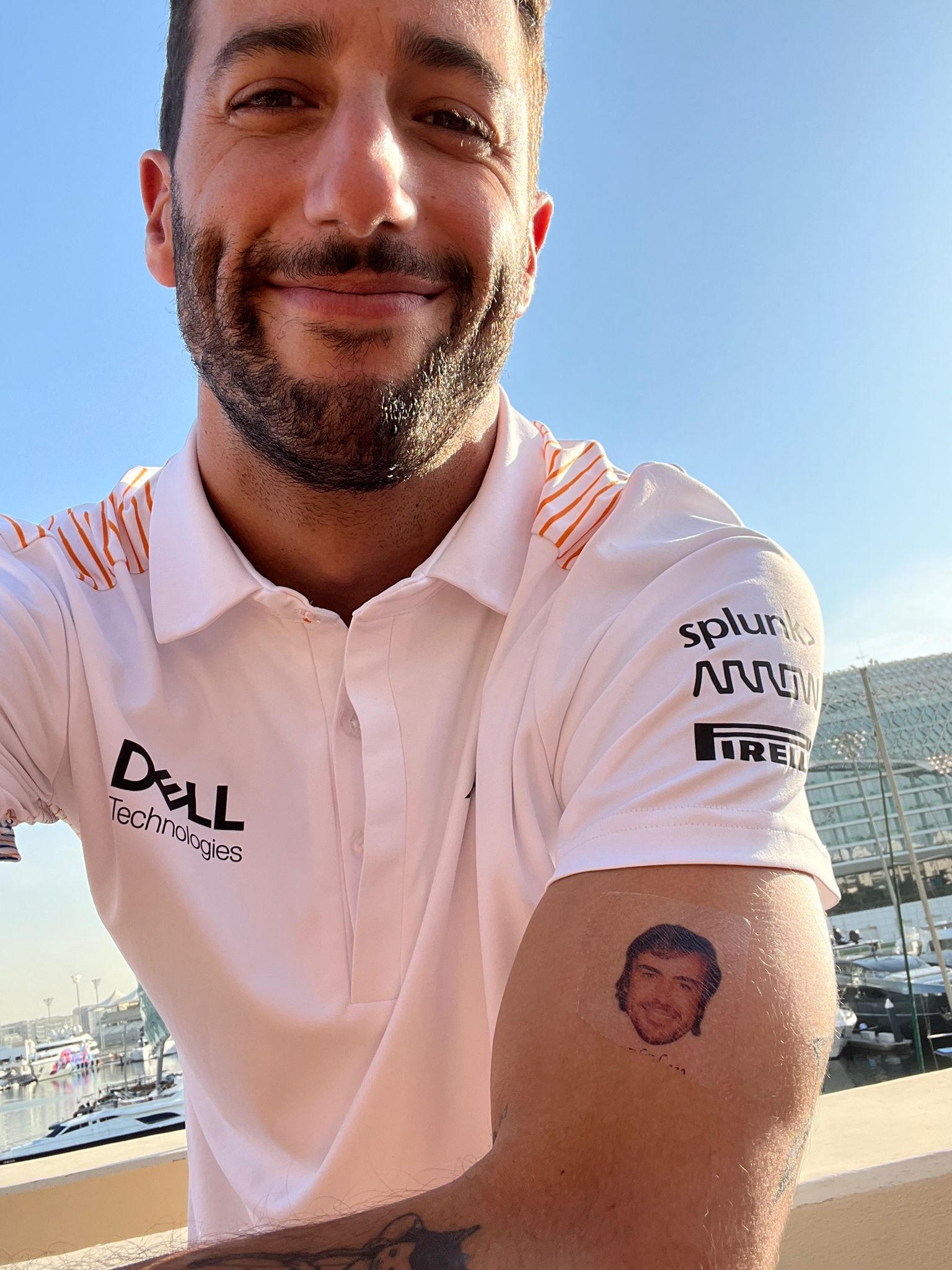 A tattoo on the neck of the Spanish Formula One driver Fernando Alonso of  Ferrari seen before the first practice session at the Yas Marina Circuit in  Abu Dhabi United Arab Emirates