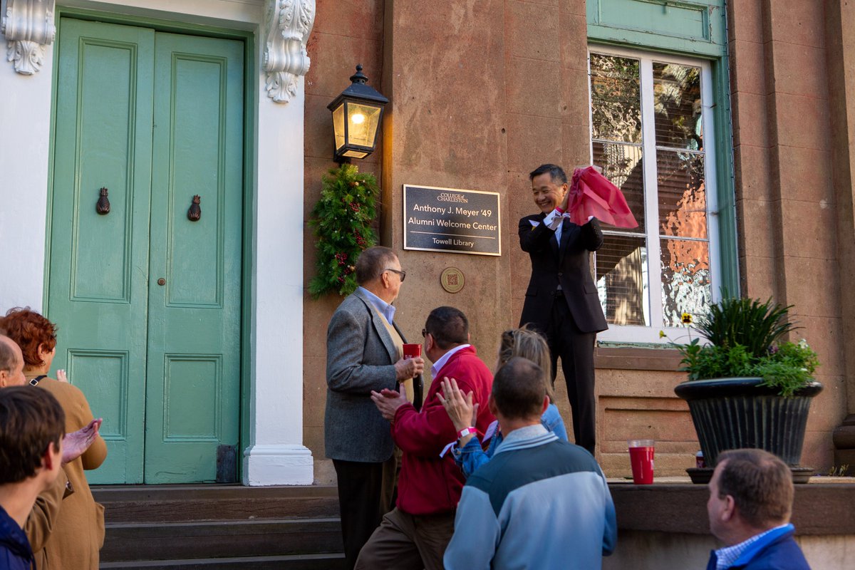 CofCalumni's tweet photo. At #FallAlumniWeekend's Lowcountry Boil, Board of Trustees Chair David Hay '81 + @CofCHsu led the dedication of the Alumni Welcome Center at Towell Library in memory of Anthony J. "Tony" Meyer '49 (1929-2020). The Concert Choir sang "Tony's favorite song," the @CofC Alma Mater. https://t.co/E9xbOJpnsu