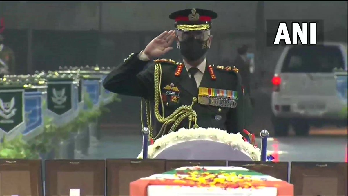ANI's tweet photo. The 3 service chiefs - Army Chief Gen MM Naravane, Navy Chief Admiral R Hari Kumar &amp; IAF chief Air Chief Marshal VR Chaudhari pay last respects to CDS Gen Bipin Rawat, his wife Madhulika Rawat &amp; other 11 Armed Forces personnel who lost their lives in military chopper crash y'day. https://t.co/HoXt8Jw0U6