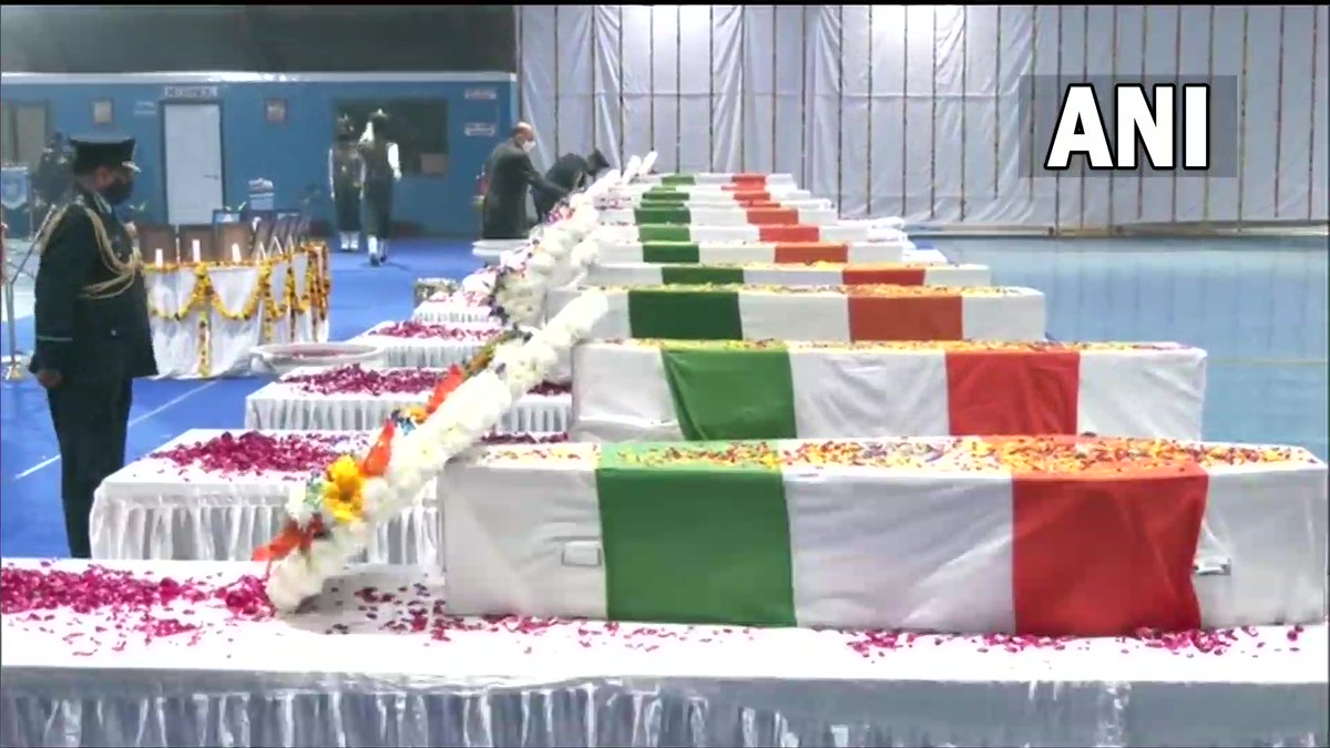 ANI's tweet photo. The 3 service chiefs - Army Chief Gen MM Naravane, Navy Chief Admiral R Hari Kumar &amp; IAF chief Air Chief Marshal VR Chaudhari pay last respects to CDS Gen Bipin Rawat, his wife Madhulika Rawat &amp; other 11 Armed Forces personnel who lost their lives in military chopper crash y'day. https://t.co/HoXt8Jw0U6