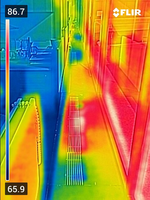 PointEnergy_'s tweet photo. The use of thermal imaging allows us to locate patterns and sources of energy loss that are invisible to the naked eye. This image shows adjacent baseboard fan coils simultaneously operating in heating and cooling which is highly inefficient.  (1/2) https://t.co/k5vAQgNHCz
