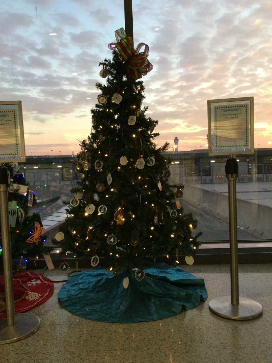 IAD_Ambassadors's tweet photo. You've heard of #FullyVaccinated?  Well, the student 🎄🎄 @Dulles_Airport are now #fullydecorated, thanks to teachers from @JML_MS_Official for coming out after school to make sure their students' decorations made it onto their tree.  #teachersrock https://t.co/YtMjIH4V8R