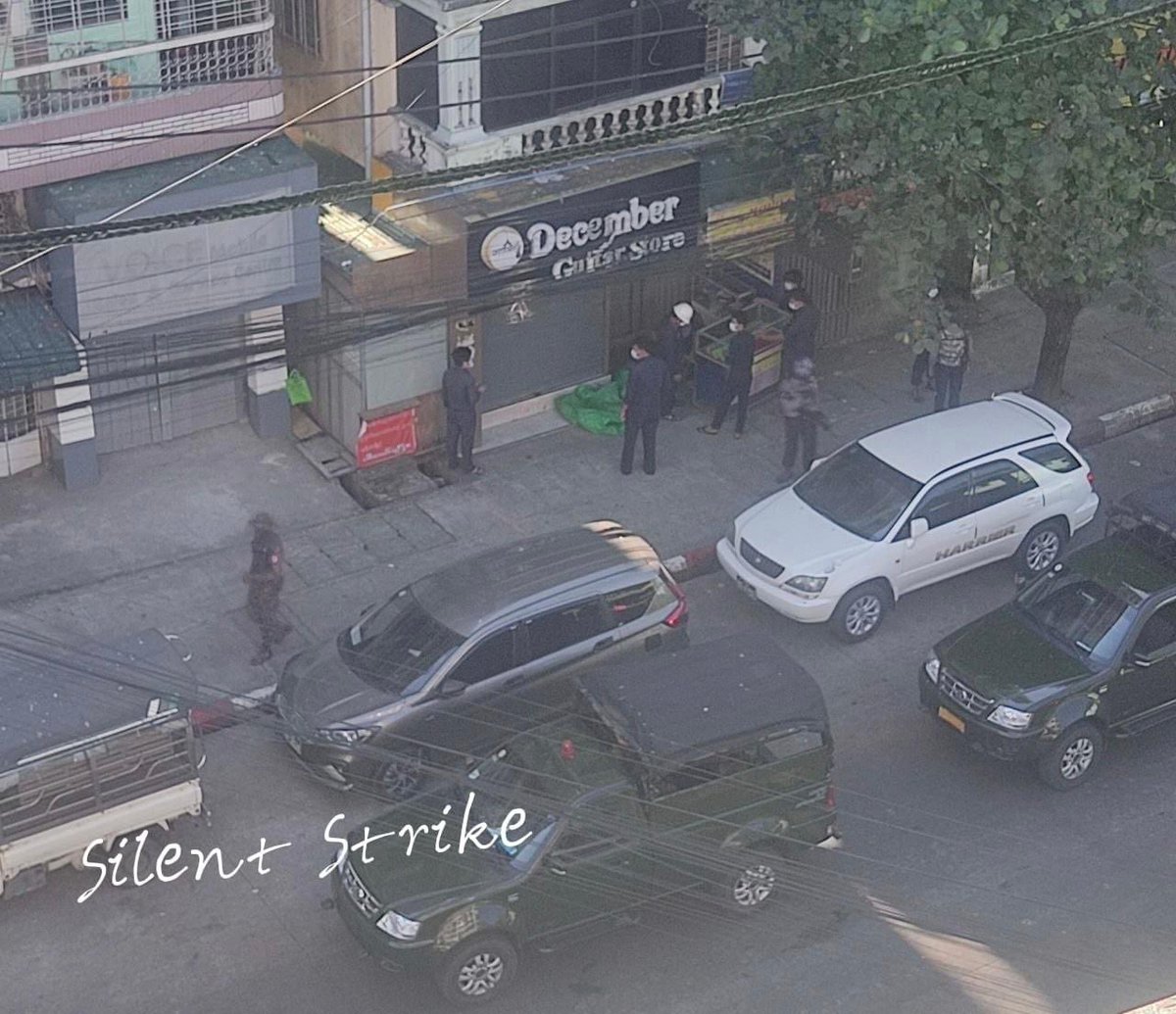 Local journalist Ye Naung posts this photo of #Myanmar security forces gathering outside an area where a silent strike is held

Sources say army seems to be confiscating items from small shops closed today 

<a href="/NUGMyanmar/">National Unity Government Myanmar</a> called for strike on human rights day