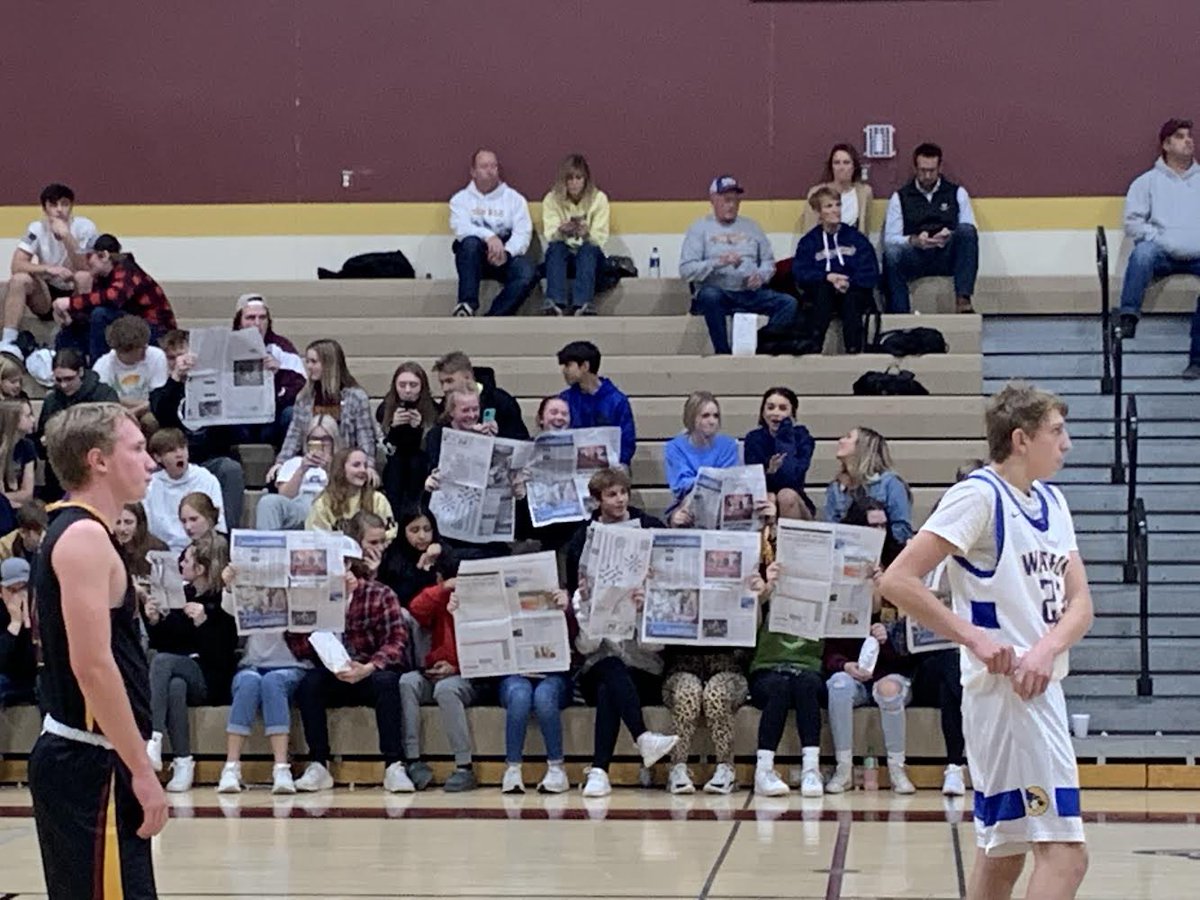 S_McD42's tweet photo. I was in and out of a couple of different games tonight and I’m so sad I missed this, but shoutout to the Medford student section for pulling out the newspapers and supporting @HenryGrayson20 with the story I wrote about his track signing that was in the paper today! https://t.co/lEplqazU1p