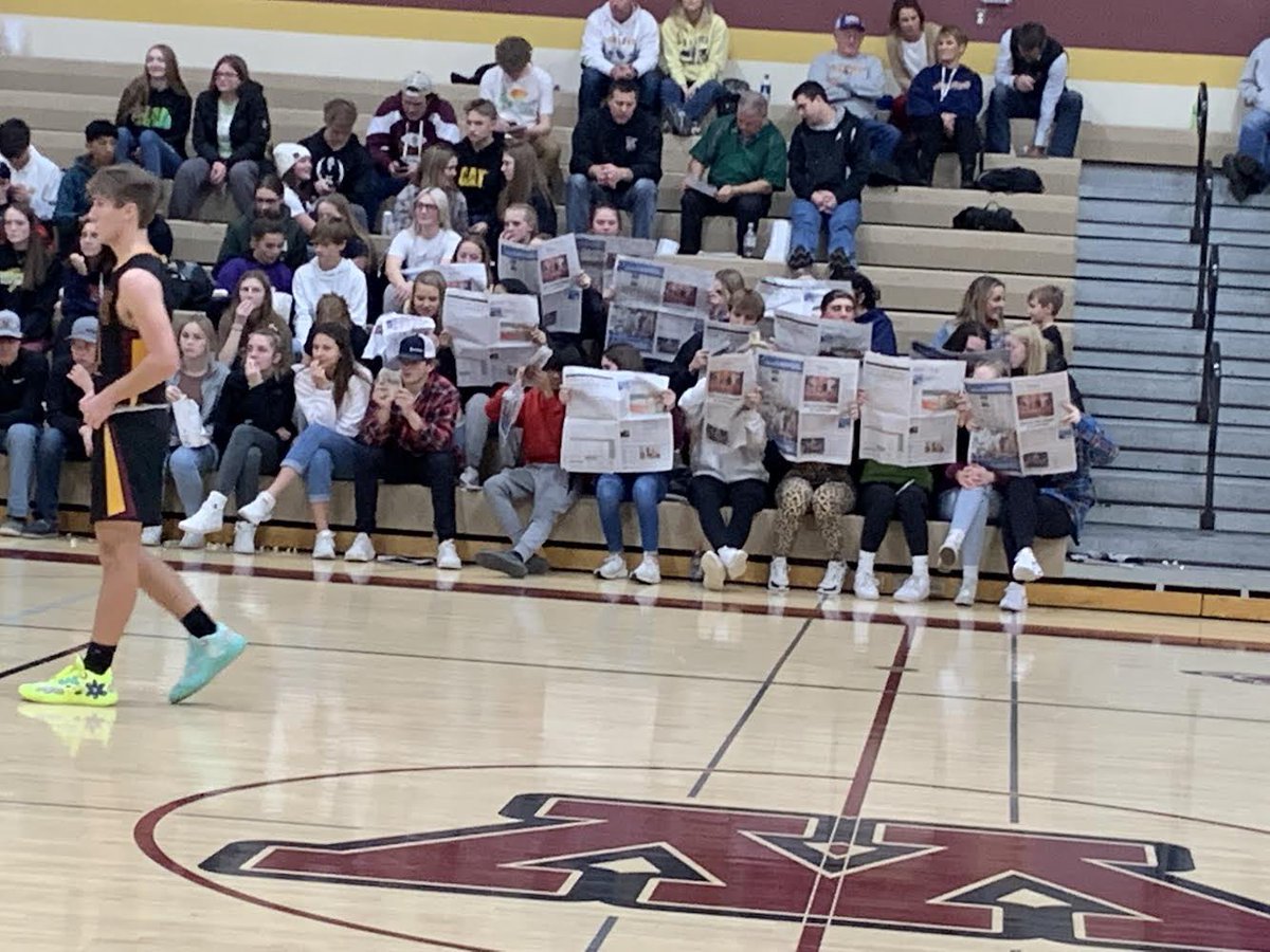 S_McD42's tweet photo. I was in and out of a couple of different games tonight and I’m so sad I missed this, but shoutout to the Medford student section for pulling out the newspapers and supporting @HenryGrayson20 with the story I wrote about his track signing that was in the paper today! https://t.co/lEplqazU1p