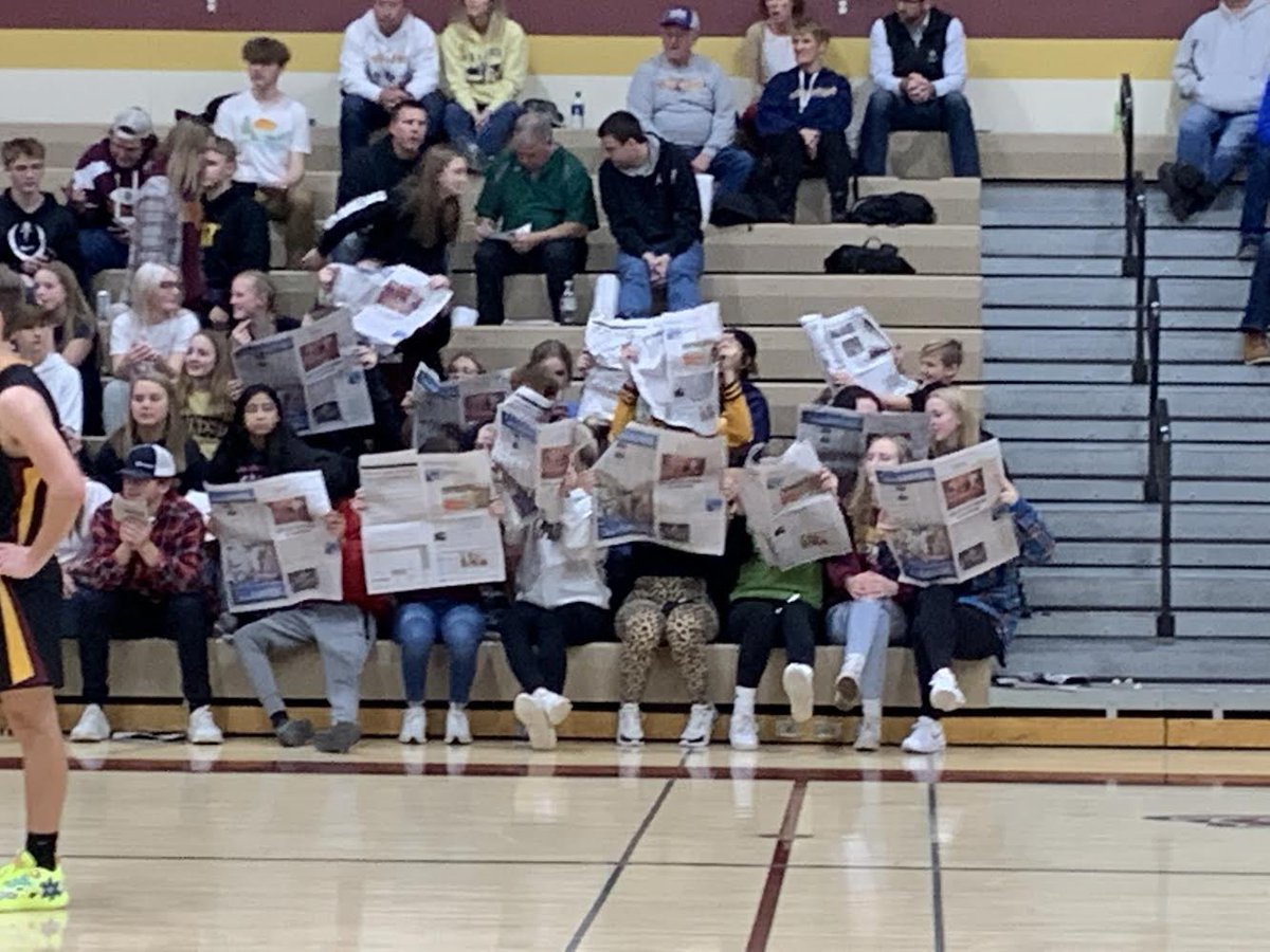 S_McD42's tweet photo. I was in and out of a couple of different games tonight and I’m so sad I missed this, but shoutout to the Medford student section for pulling out the newspapers and supporting @HenryGrayson20 with the story I wrote about his track signing that was in the paper today! https://t.co/lEplqazU1p