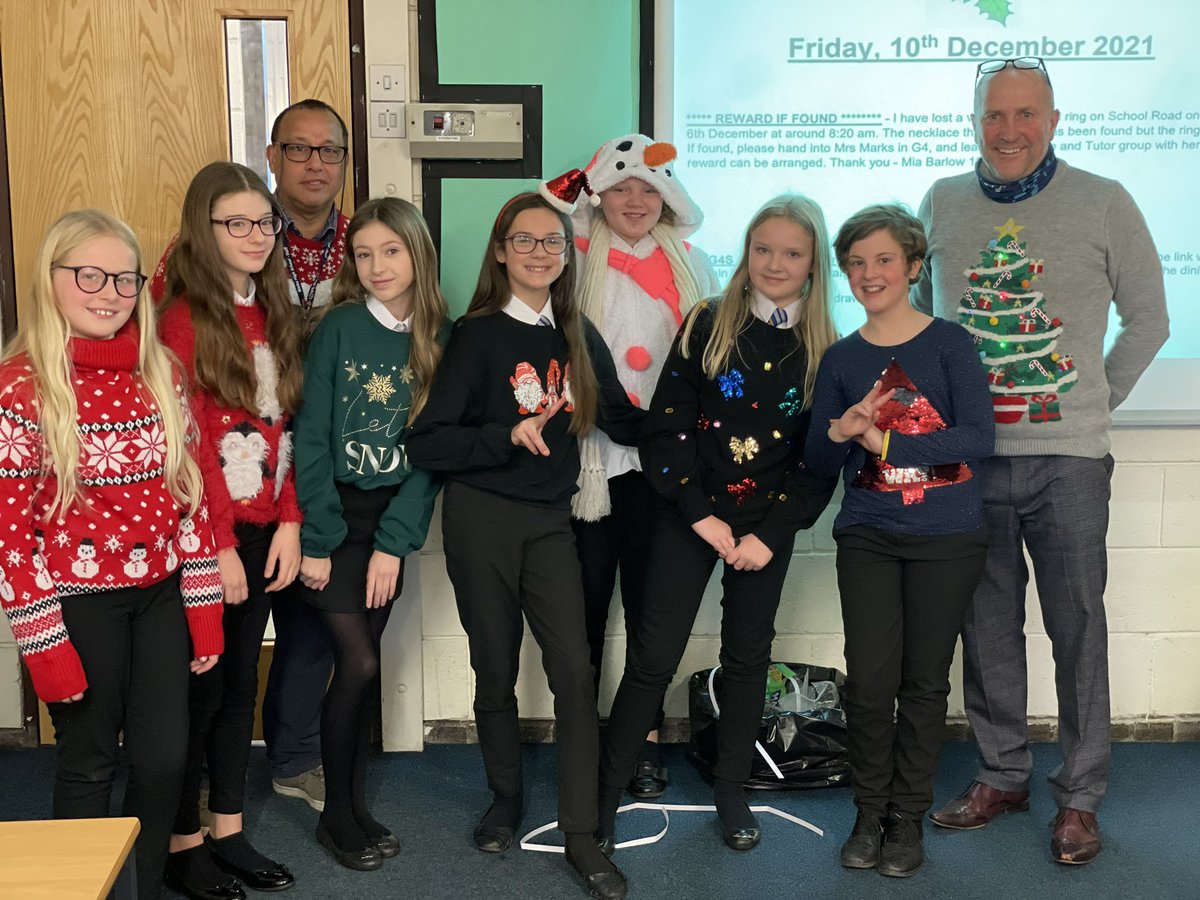 WalesHigh's tweet photo. Christmas jumpers in the Maths department! Mr Evans and Mr Bradley in matching jumpers 🥰 #christmasjumperday https://t.co/QhXf3pgOa2