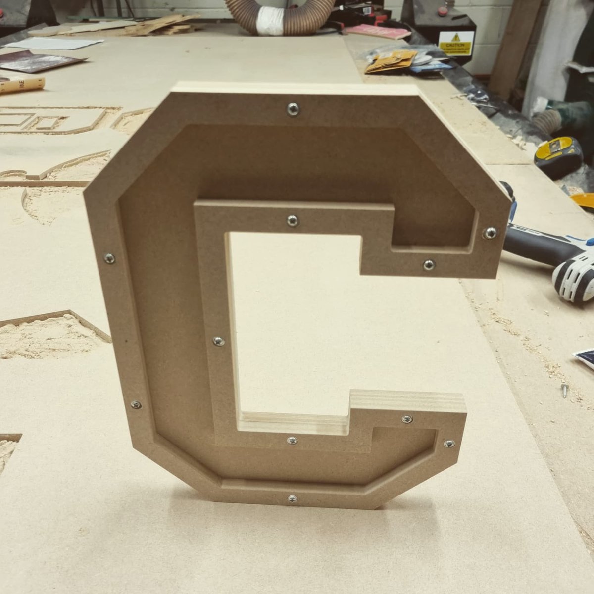 Thelasergeek's tweet photo. Prototyping some industrial style letters.  Thought they would look good with actual screws. 
Just some of the fun things I try to make on my CNC while streaming on twitch.  

#letters #sign #font #industrial #protype #maker #craft #style #twitch #cnc #screw #rivet #metal https://t.co/aj6LJAtlcy