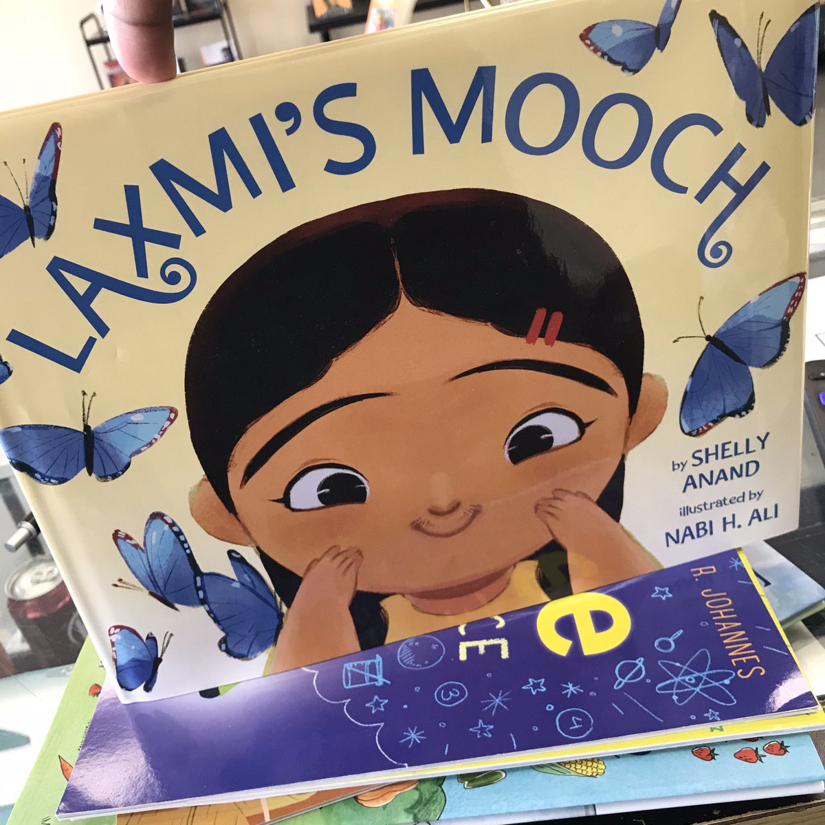 New to our shelves and online store: #LaxmisMooch by #ShellyAnand! You can grab a copy in-store or you can order your copy of the books on our website at demoir-books.square.site ☺️📚