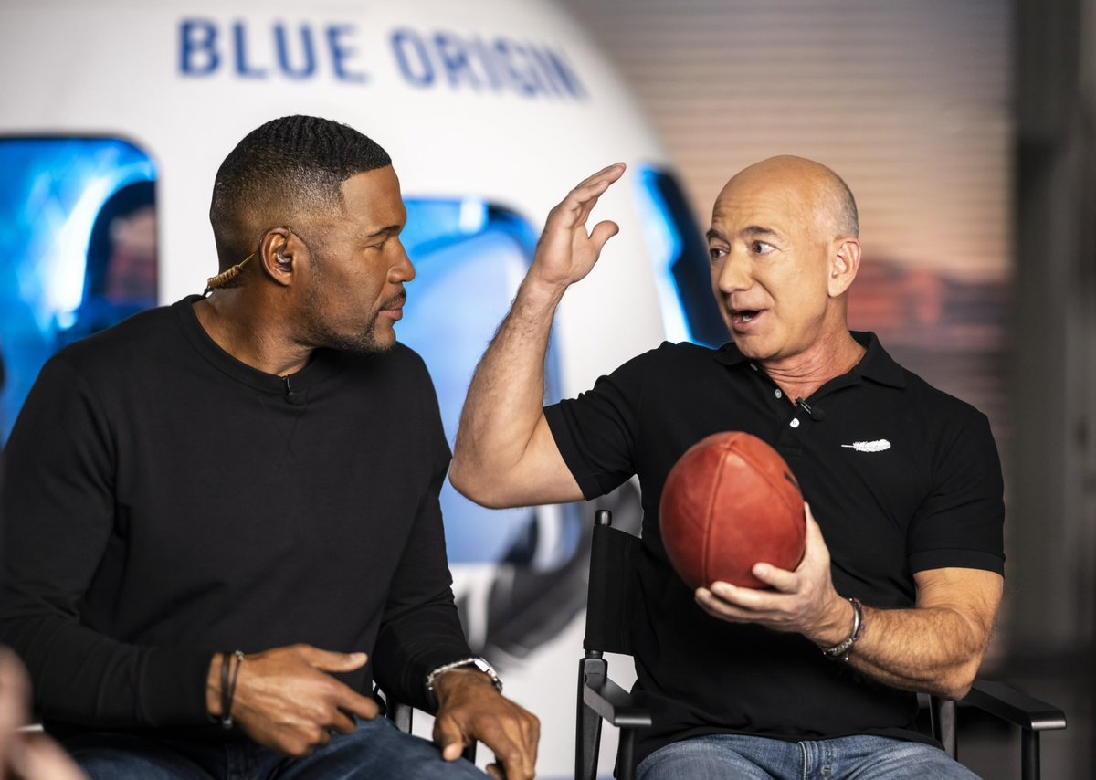 JeffBezos's tweet image. Loved being with @MichaelStrahan on Thursday Night Football. Gave him a little something to pack for his flight.