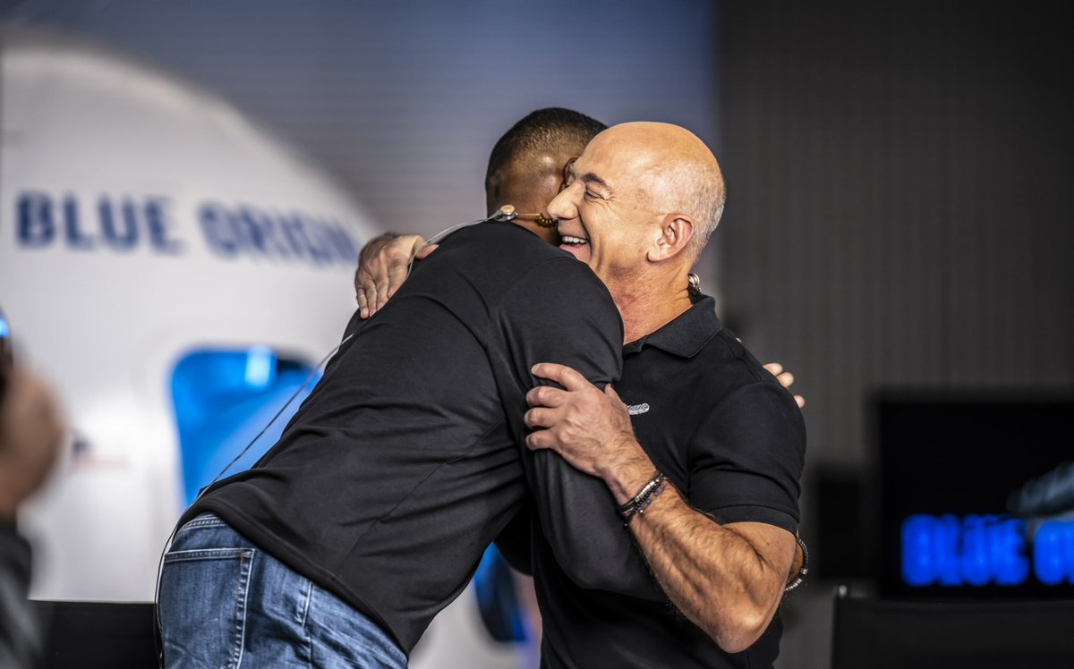 JeffBezos's tweet image. Loved being with @MichaelStrahan on Thursday Night Football. Gave him a little something to pack for his flight.