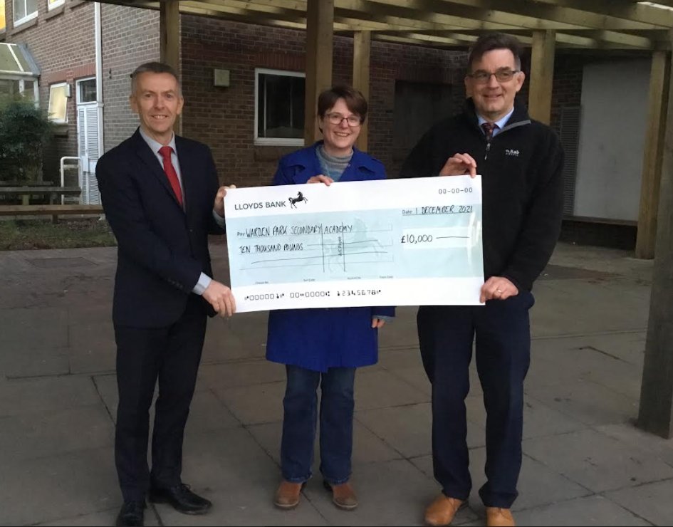 wardenpark's tweet photo. Last week, @FriendsOfWPSA  Chair, Ann Williams, presented a cheque to Dom Kenrick, Headteacher, and Colin Granlund, Business Manager for £10,000. All monies raised have gone towards our ambitious and ongoing canopy project.  @wardenpark https://t.co/AJpbW8LVO8