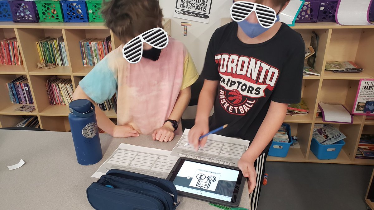 The students completed a QR Code Scavenger Hunt with Math Vocabulary! Students had to match the symbols to the math terms we've explored this unit. These two were discussing in French why they thought this image could represent estimation #kinesthetic #technology #kinetech