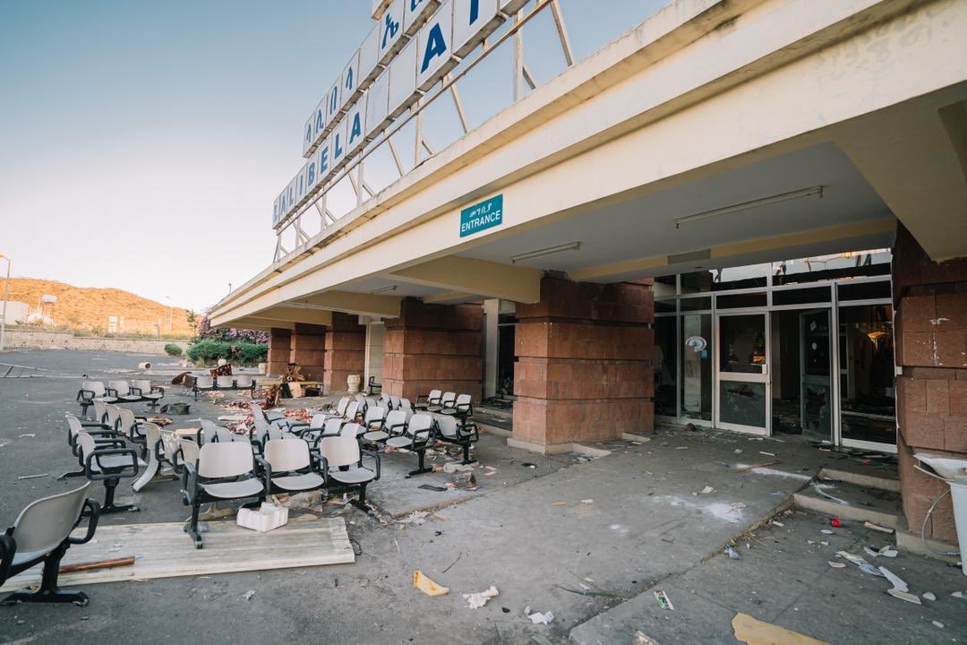 MFAEthiopia's tweet photo. The terrorist Tplf proved that it is public enemy number 1. Here are samples of health institutions, public buses, hotels, airports &amp; banks that are destroyed by the group in Amhara region. What’s that got to do with ‘protecting’ Tigray? https://t.co/X2kQWgafnE