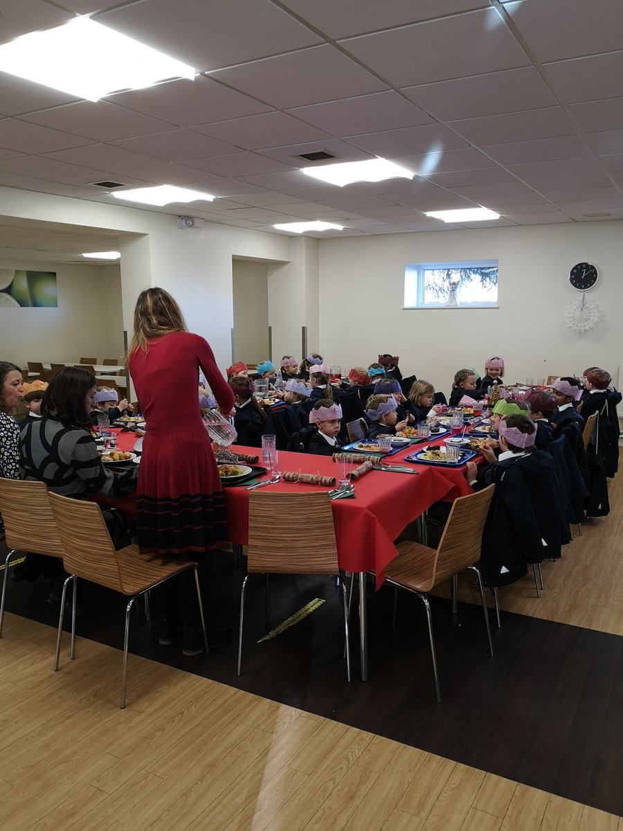 LaxtonJunior's tweet photo. What a treat - Christmas lunch with all the trimmings, including crackers and hats! #WeAreLJS https://t.co/OdL16jRmnV