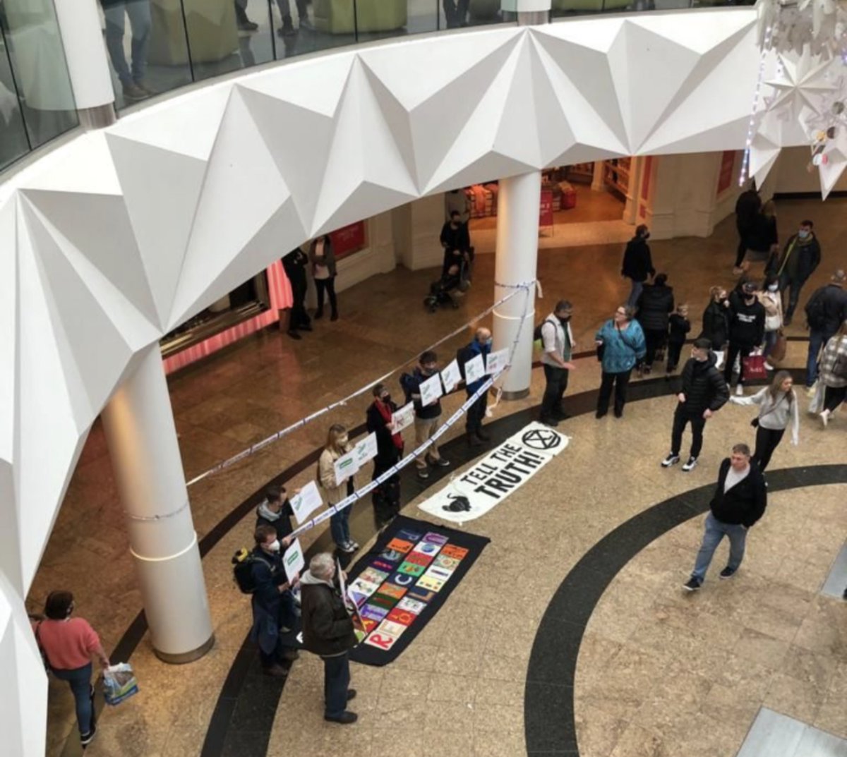 XRShef's tweet photo. This protests targets greenwashing techniques and exploitive capitalistic systems rather than individual shoppers. 

Come join us and say hello if you’re nearby!
#Meadowhall #Meadowhell #Greenwashing #CorporateGreed https://t.co/0vsxZygDeH
