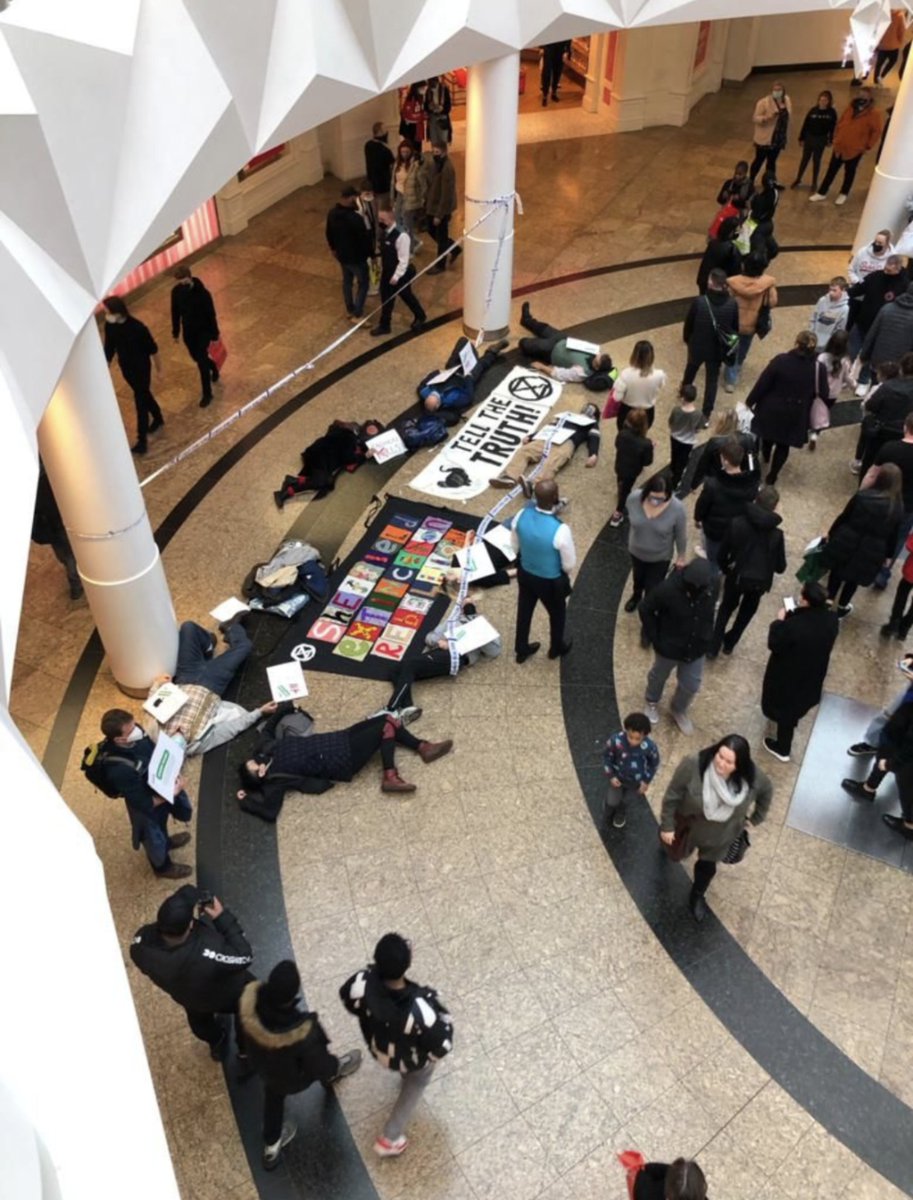 XRShef's tweet photo. Rebels stage a die in at #Meadowhall
Drawing attention to greenwashing tactics and exploitive capitalistic systems, rather than individual shoppers.

#TellTheTruth #SystemChange #CorporateGreed #Greenwashing #Meadowhell https://t.co/aPeN1IzyiQ