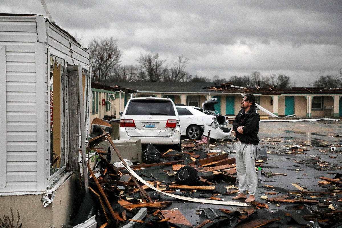 A resident of the The Cardinal Inn in Bowling Green, Kentucky, looks at the damage after a tornado touched down. 

📷 Gunnar Word / AFP

nbcnews.to/3GxTXLM