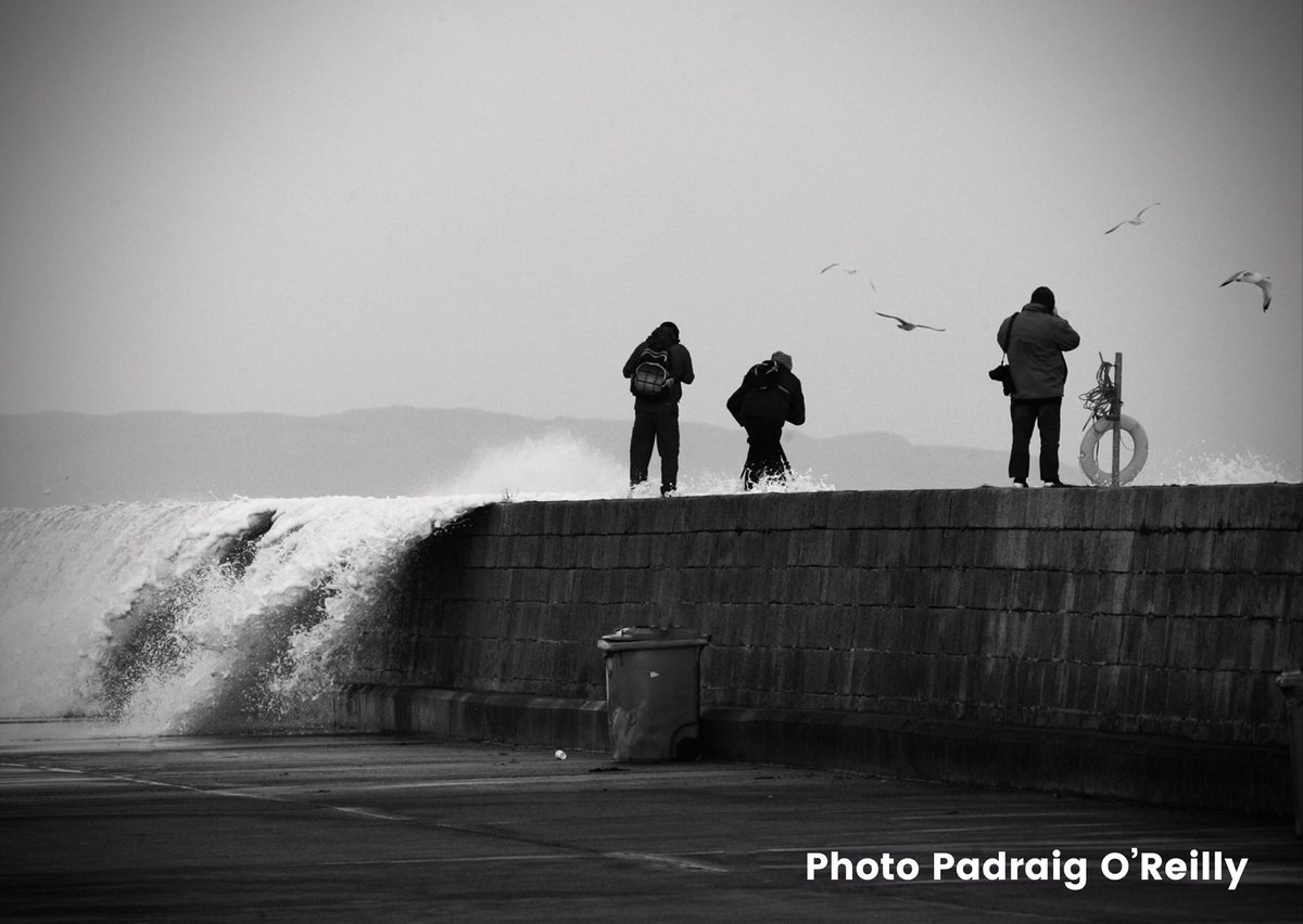 My photo shows people capturing #stormbarra from the east pier in Howth,Co.Dublin on Tuesday.