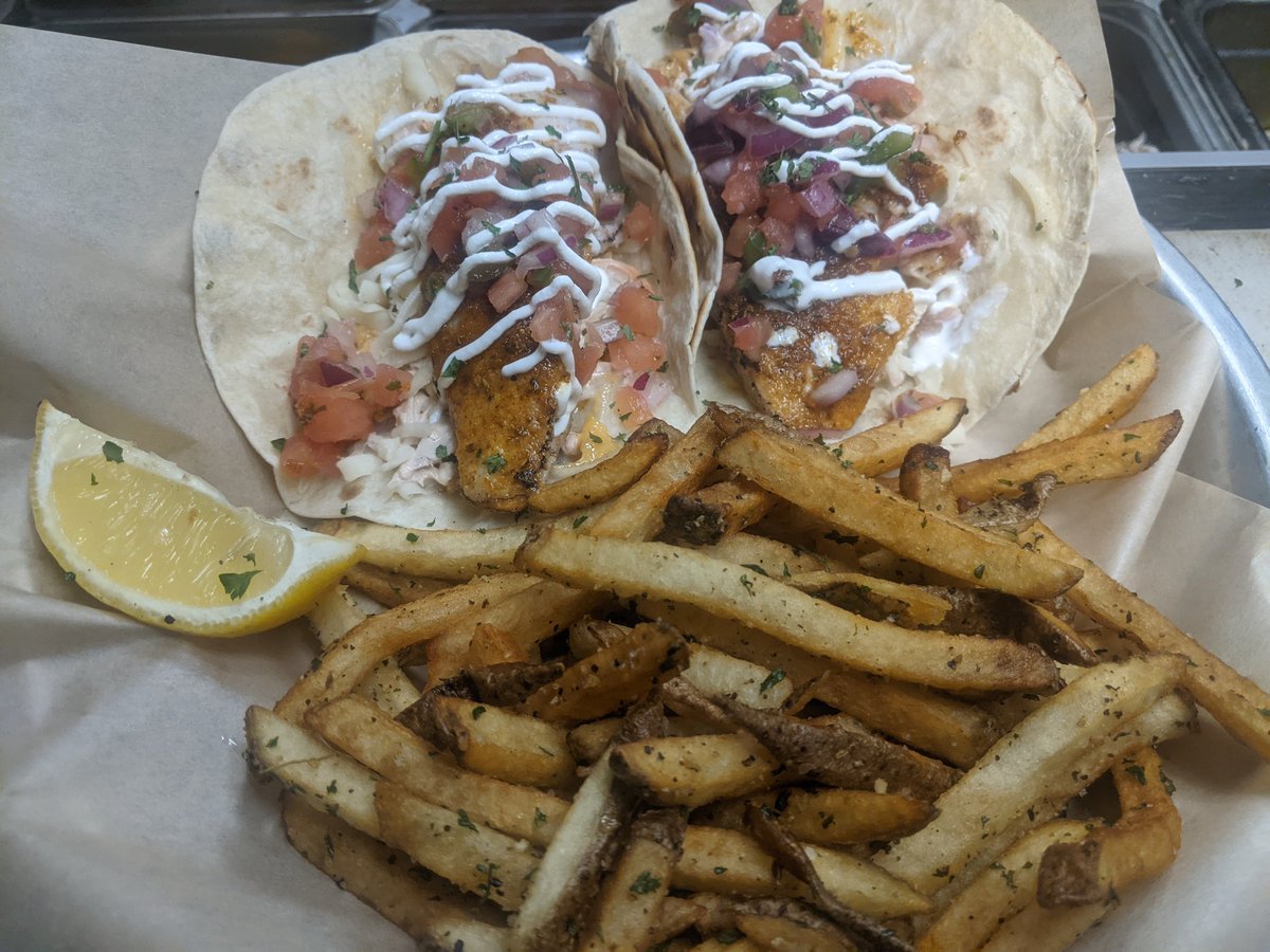 Cajun tilapia with slaw pico and cilantro crema #handcutfries