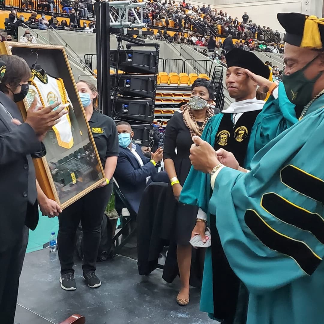pwilliamsworld's tweet photo. Congratulations Dr. Williams 🎓 After his inspiring commencement address for @Norfolkstate's class of 2021, @Pharrell was awarded a Doctor of Humane Letter honorary degree AND was made an honorary member of the Spartan Legion Marching Band 🥁 

(📷: T. L. Best, BK Fulton, NSU) https://t.co/WCqg49YbnP
