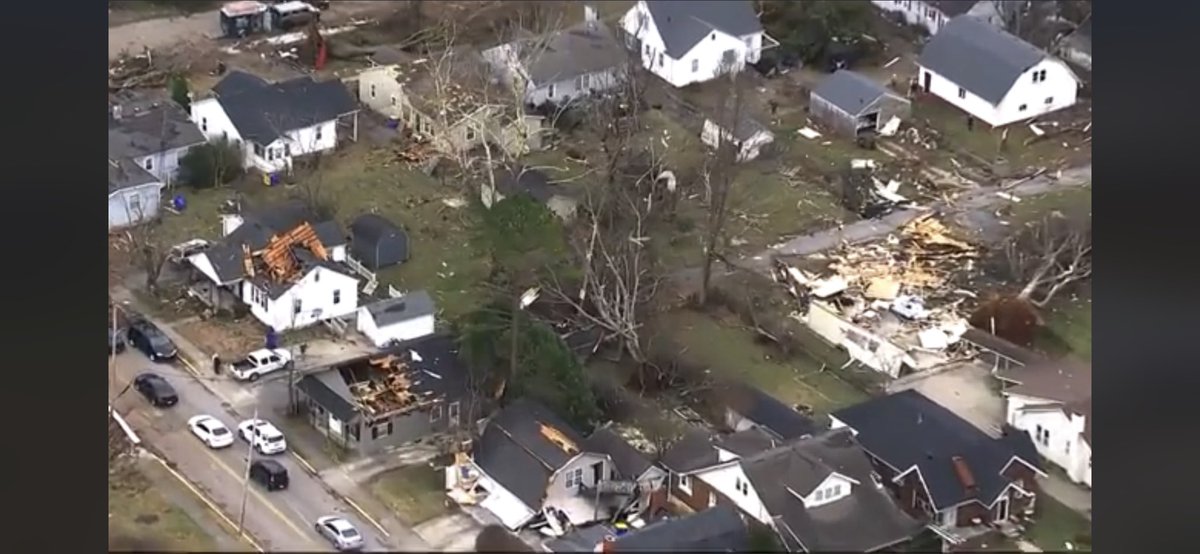 ColeClaybourn's tweet image. Aerial footage from my neighborhood. The green house in the top left in the red circle is ours. Just so much devastation around us.