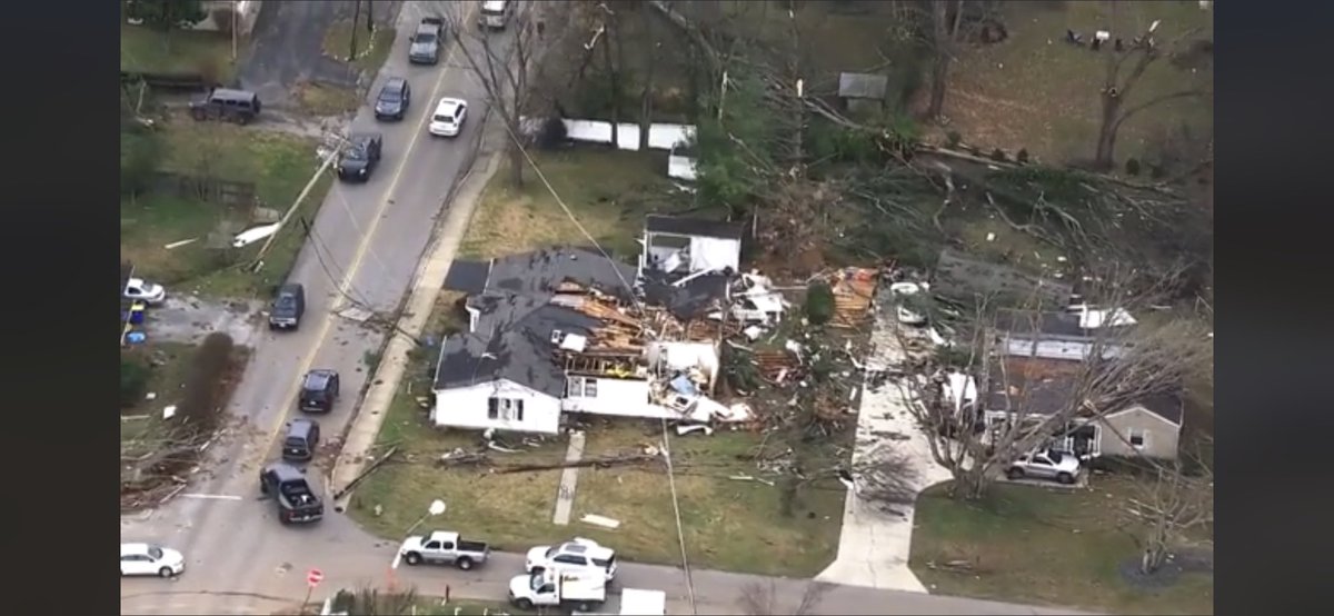 ColeClaybourn's tweet image. Aerial footage from my neighborhood. The green house in the top left in the red circle is ours. Just so much devastation around us.