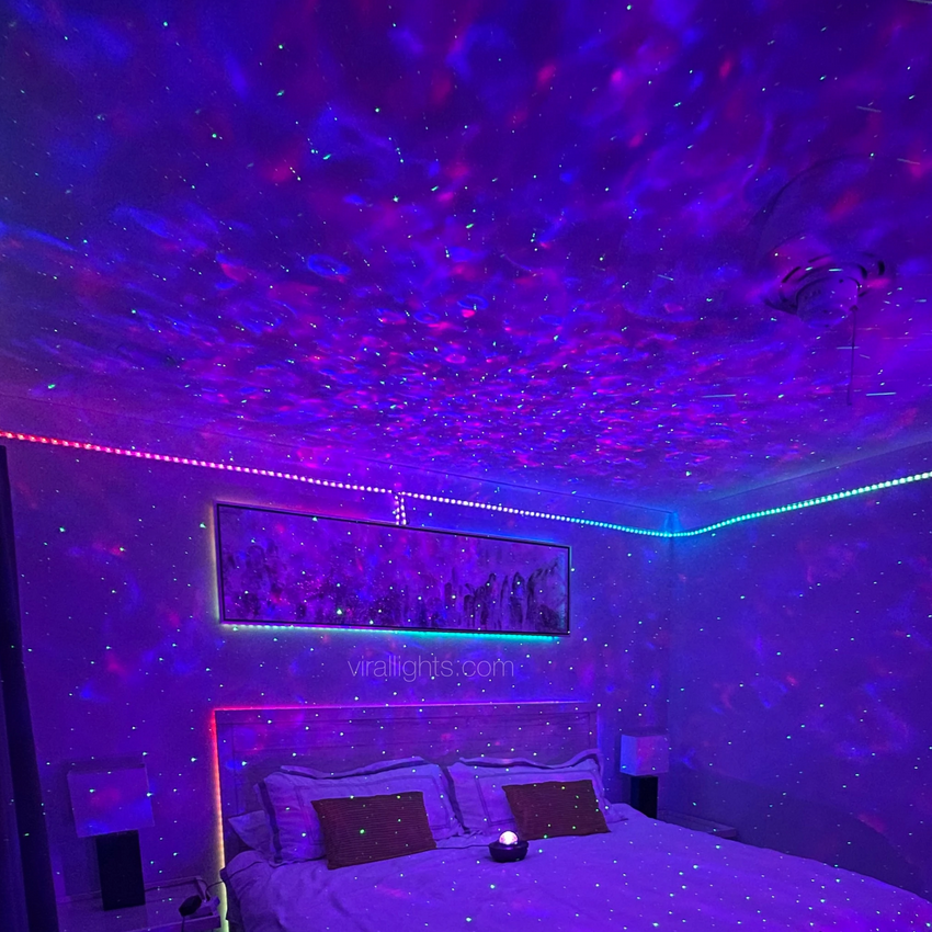 [considering that kris has run away, it may seem like the perfect setup for a cheeky "false gift" prank...but nope—just actual gifts this time! inside the box is a t-shirt, as well as one of those neat galaxy projector night light thingies that makes the room look like. that.]