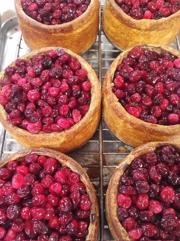 Mrcspies's tweet photo. 4 years ago today,  these pies were sent via courier to @Fortnums part of a huge order pre Christmas.
These were our wonderful "Christmas pies" layers of Turkey and Ham with chestnuts, a middle layer of pork, sage and onion stuffing,  pork jelly topped with sweetened cranberries https://t.co/eMAvyfMkJu