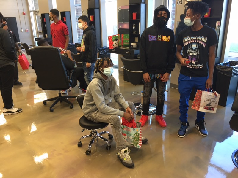 JohnRobinzine's tweet photo. Cosmetology/Barbering students celebrating the holiday season with their very own Secret Santa.  #wearefamily https://t.co/hAVijevosO
