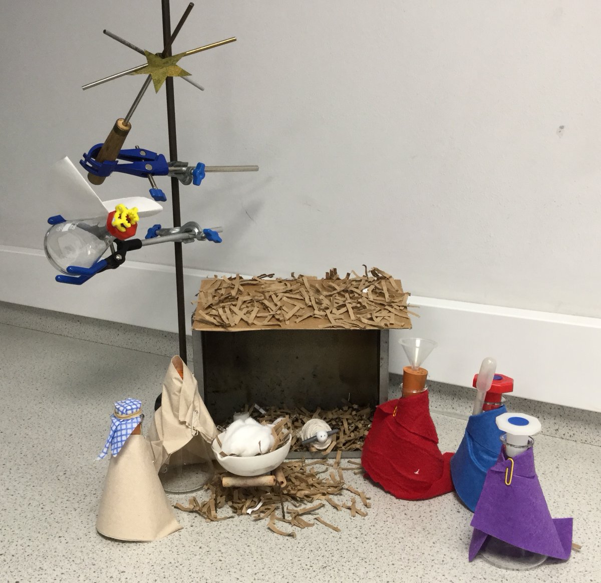 GordonsSch's tweet photo. Even the @GordonsScience Department is #beginningtolookalotlikechristmas! Their nativity scene is made entirely from equipment in their preparation room! Glass conical flasks, conduction equipment, an evaporating basin as a cradle and string around a funnel tap for the sheep. https://t.co/fBoY3ue8nX